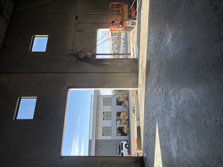 Openings cut into concrete tilt up panels on a commercial building
